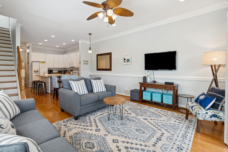 Living room with access to the screened in patio.