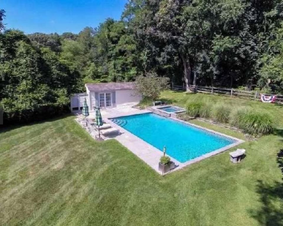 Huge yard!  Pool house has daybed, changing room, & outdoor shower.  