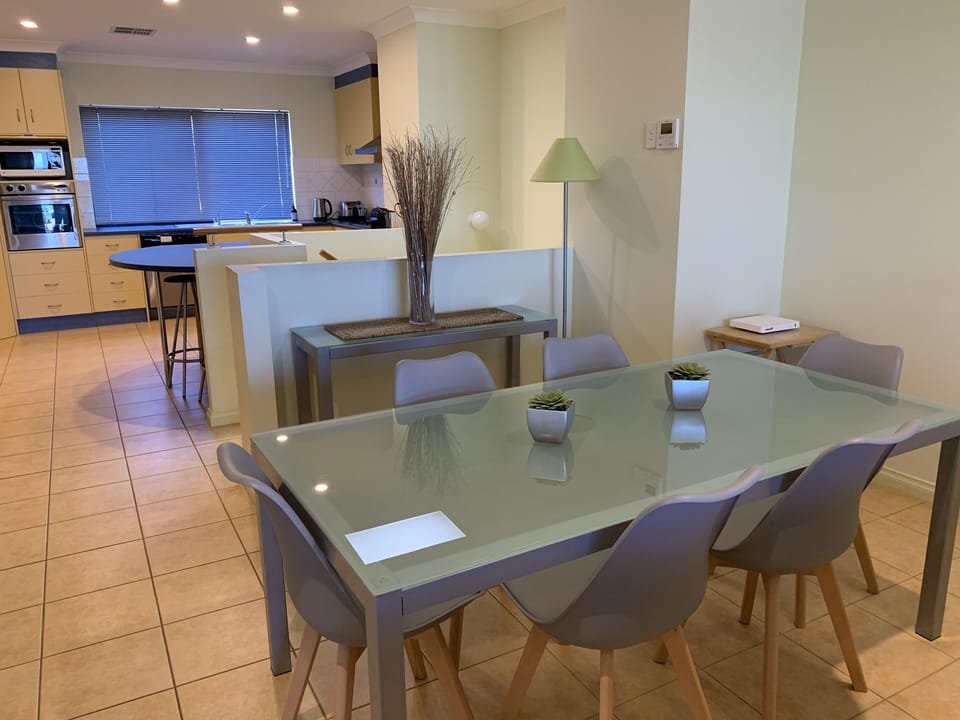Kitchen with wall oven, microwave, large fridge, dishwasher & Dining area