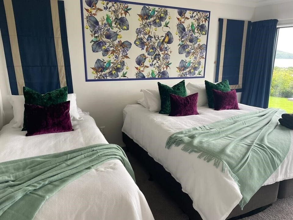 Superking & Single bed (or 3 x Singles) with lake view and TV.