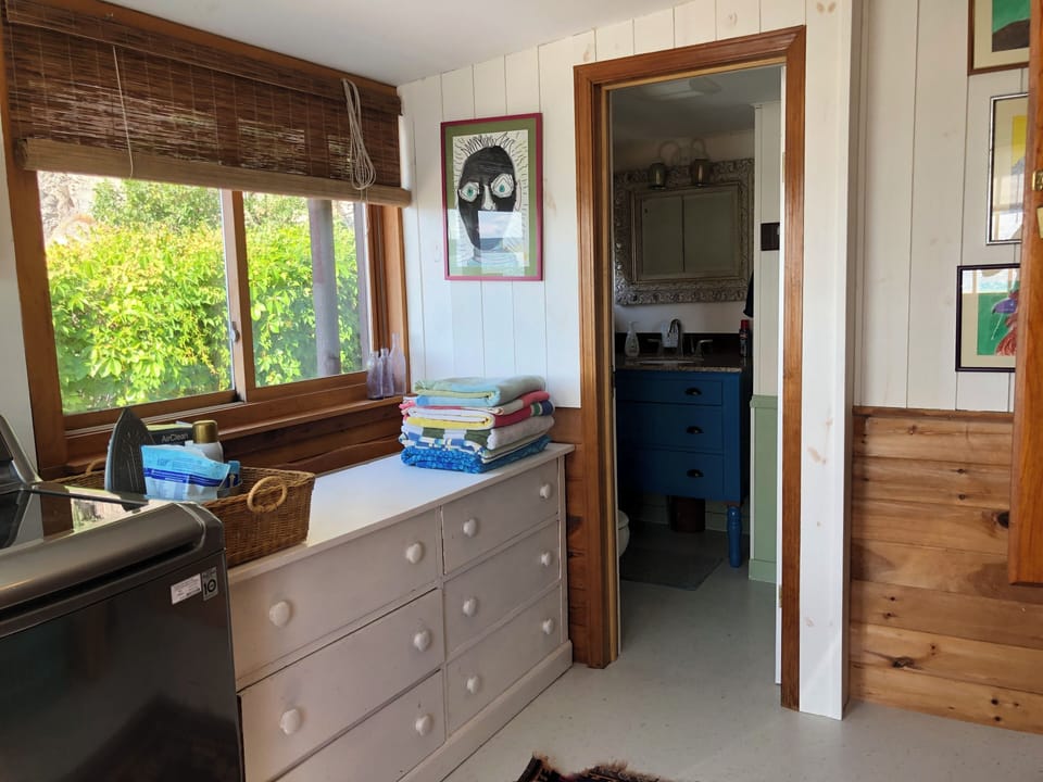 The third bathroom is just off the laundry room.