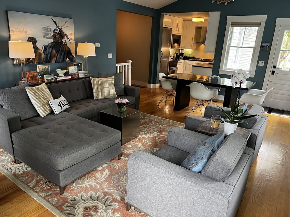 The living room features plenty of space to relax or entertain a few friends.