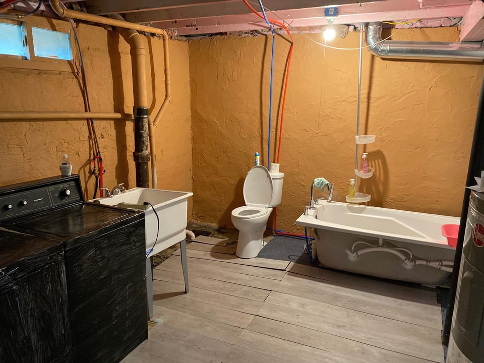 Basement Jetted tub wash room / with laundry area 