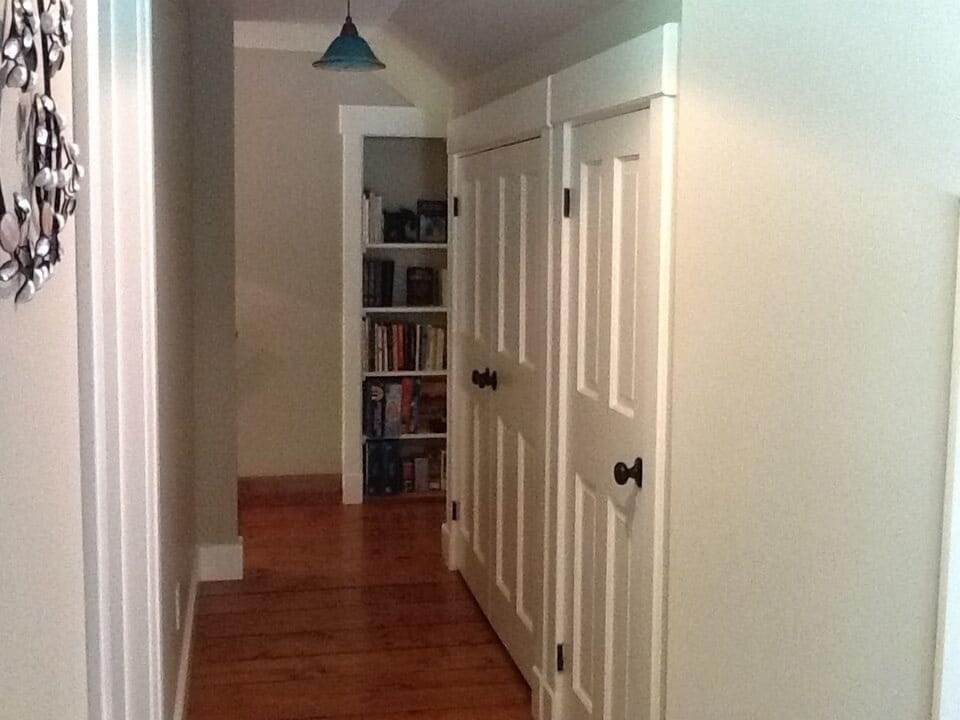 Washer, dryer, laundry supplies behind closed doors; games, etc. on shelves