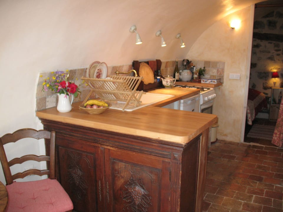 Kitchen and view toward adorable single bedroom