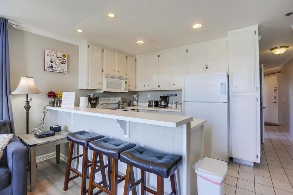 Open style kitchen with bar seating for 3.