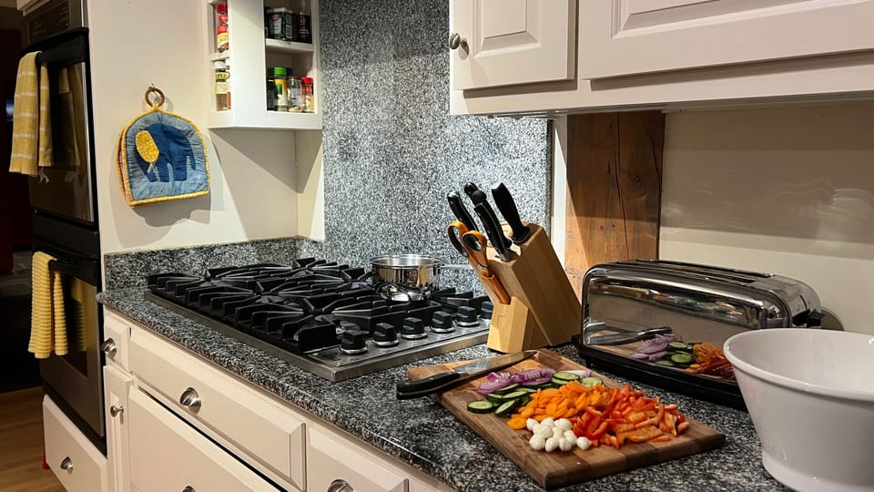 6 burner Viking stove, double ovens, fully stocked pantry, and utensils.