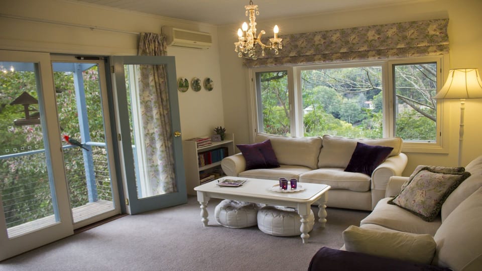 Living room with garden and mountain views