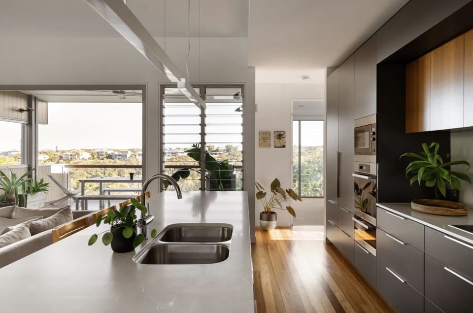 Modern kitchen with Miele appliances and generous bench space.