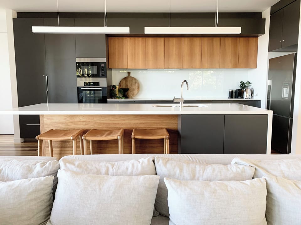Modern kitchen with Miele appliances and generous bench space.