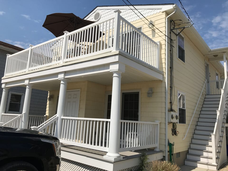 Back of the home , 2 car parking for the second floor in the rear of the home .
