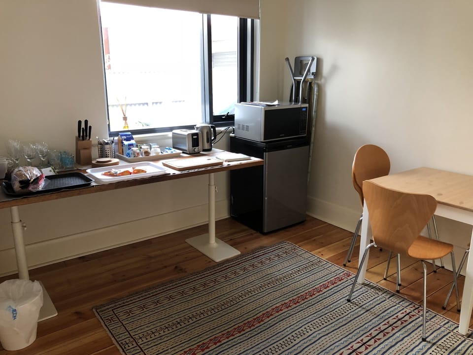 Kitchenette, fridge, microwave, kettle, toaster, crockery, cutlery, glass, seats