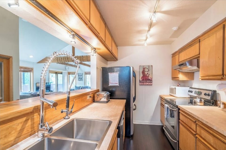 Fully equipped kitchen with pots and pans and serving dishes