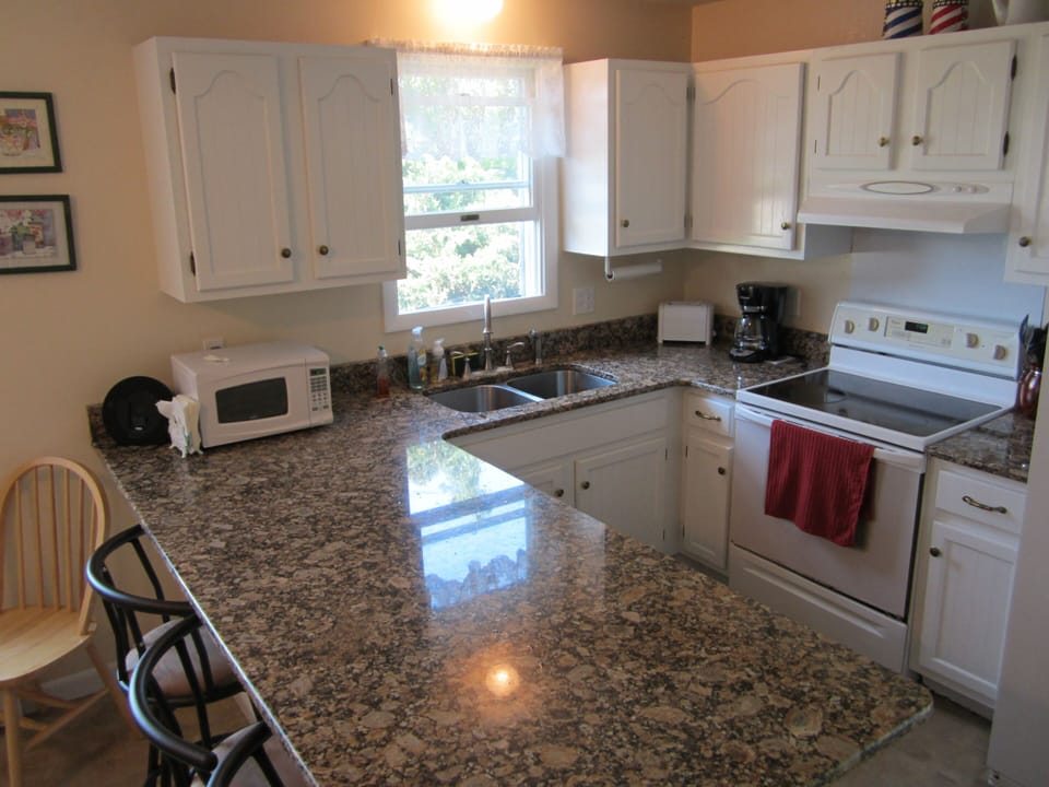 Plenty counter space (3' wide) Seats 3-4, New under-mount sink with new faucets 