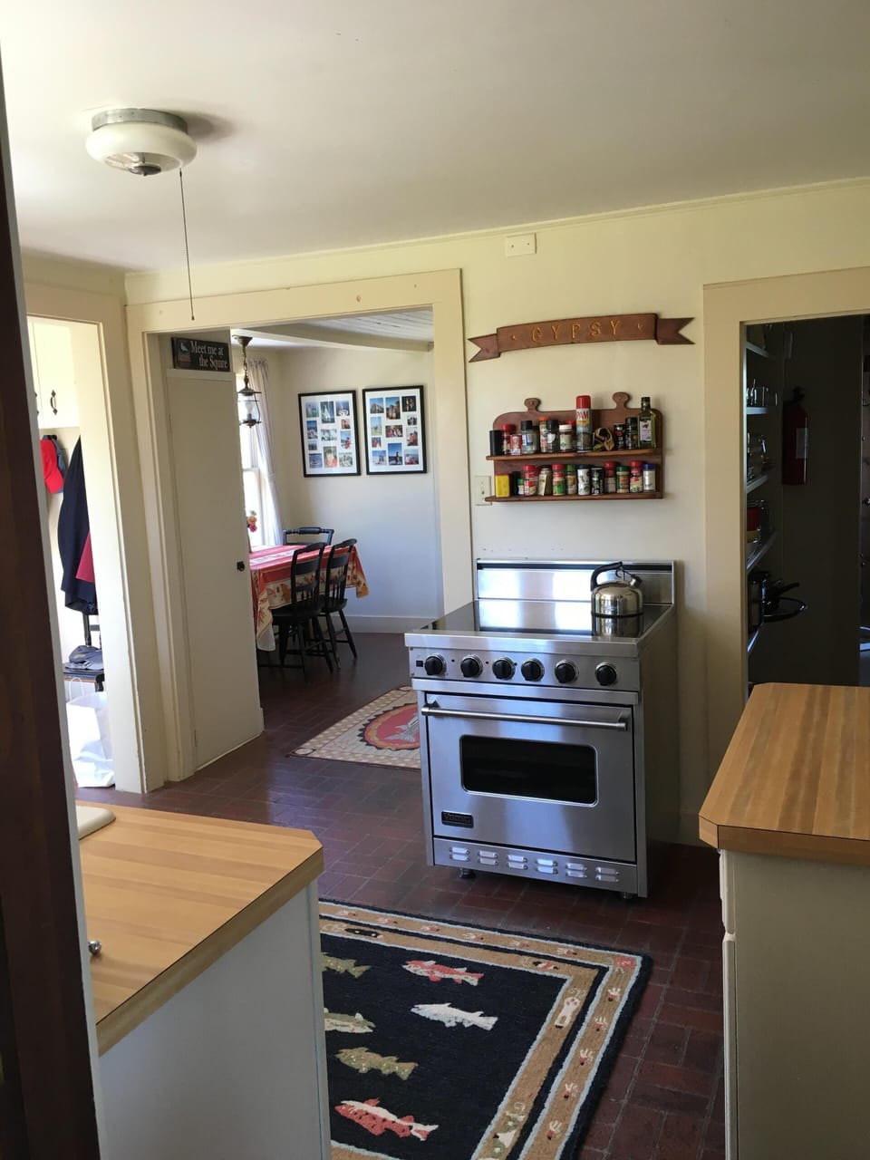 Kitchen looking toward pantry to right and breakfast area to left with bathroom