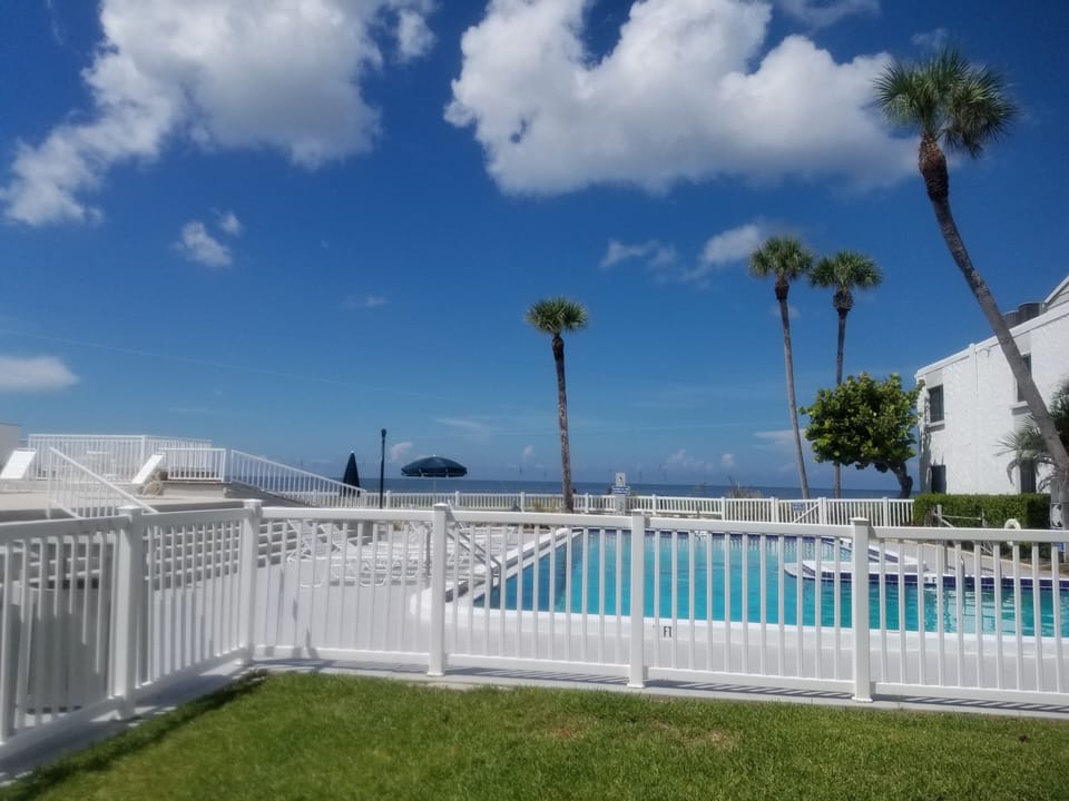 Heated Pool directly on the beach, next to Club House and Deck Area.