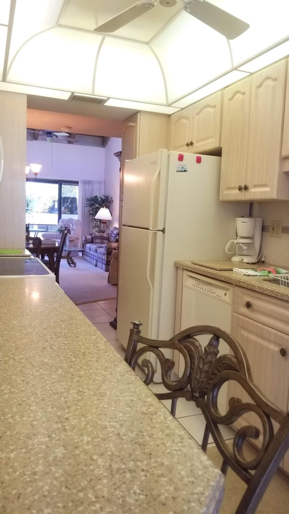 Kitchen has counter top with seating for two.