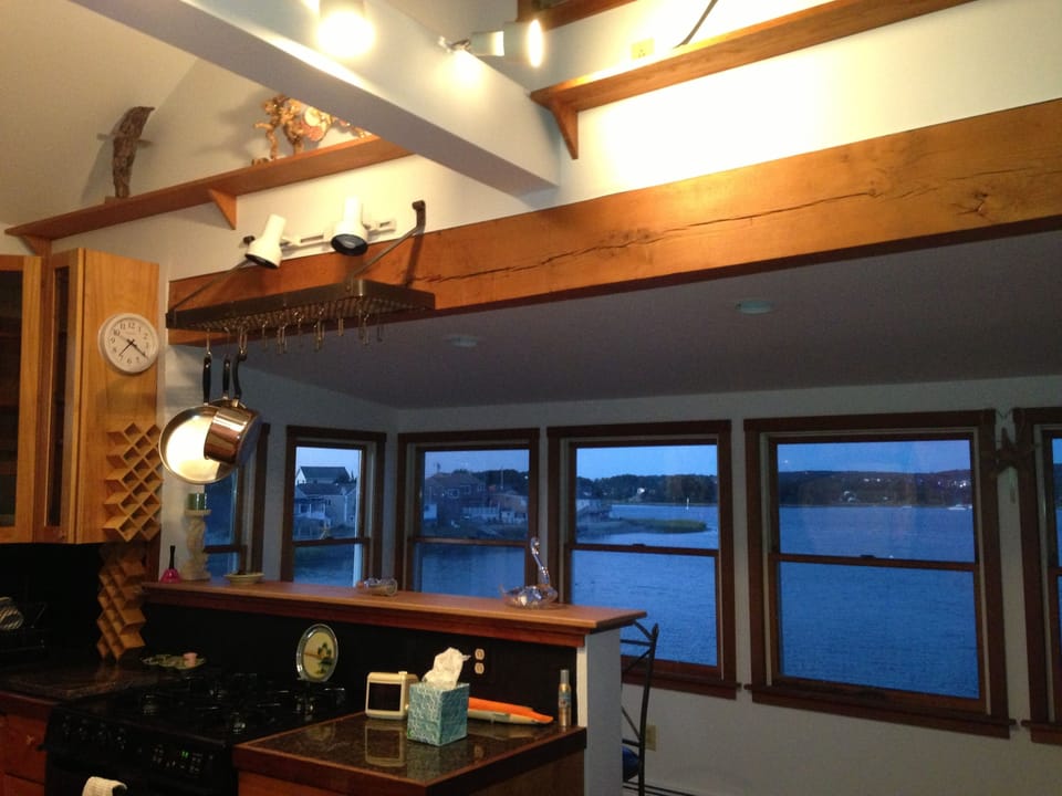 shows some of the windows and stove area overlooking the ocean