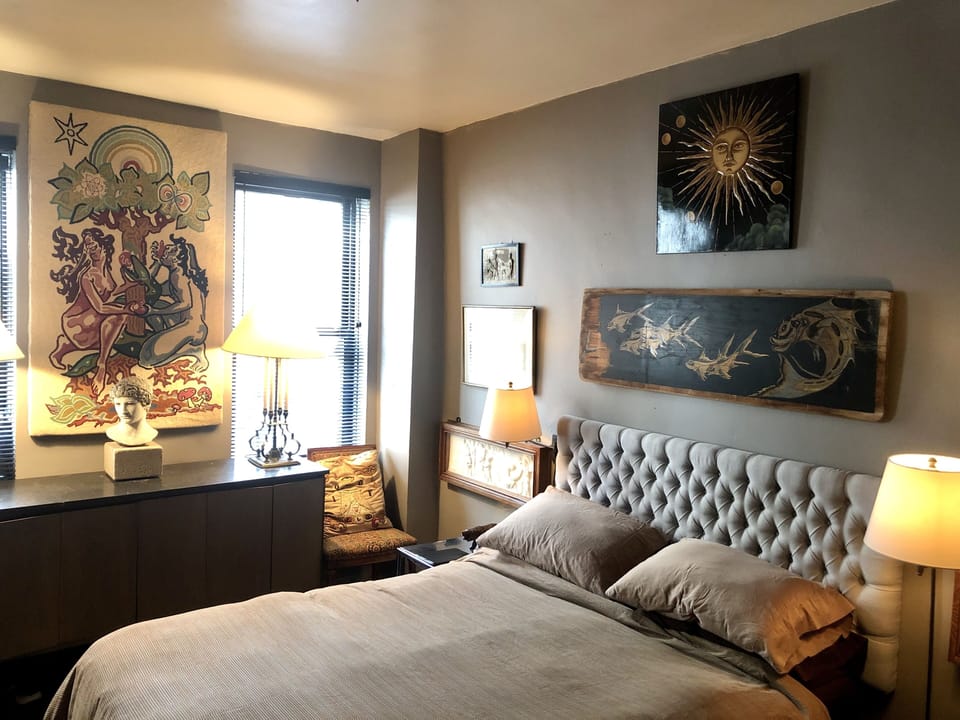 Queen size bed in large bedroom