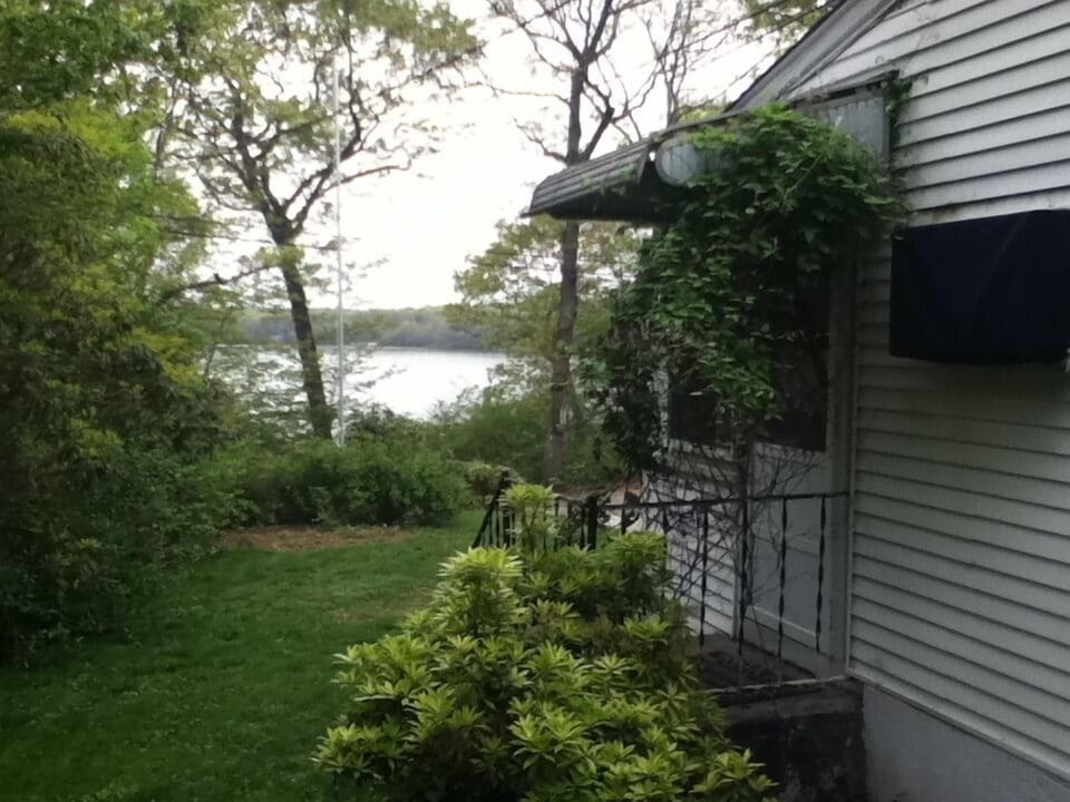 Side of the house facing Watchaug Pond