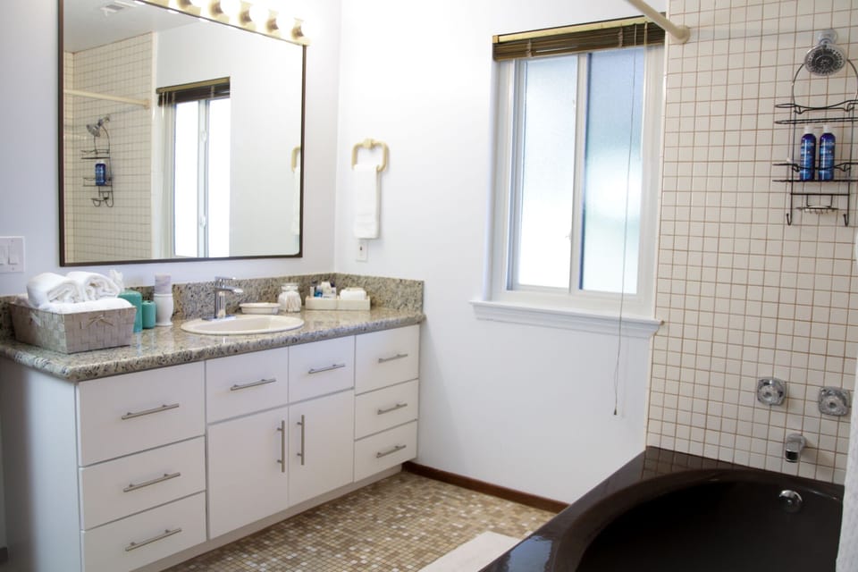  Bright Full Bathroom - Shower & Tub - with a few select amenities.