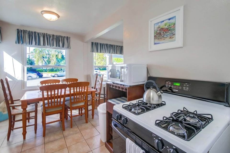 Kitchen into the dining room with seating for 6
