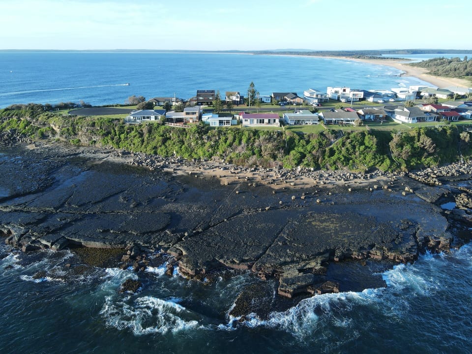 Aerial of Culburra headland and rock platform.