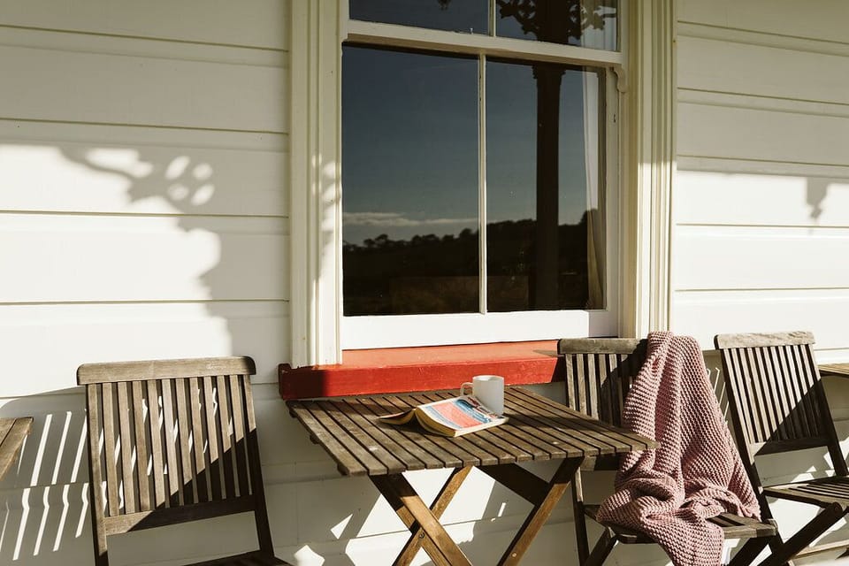 A sunny spot on the wrap-around veranda to enjoy late afternoon sun and a boot