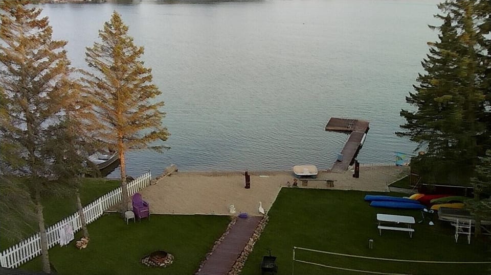 Aerial view of backyard with sandy beach