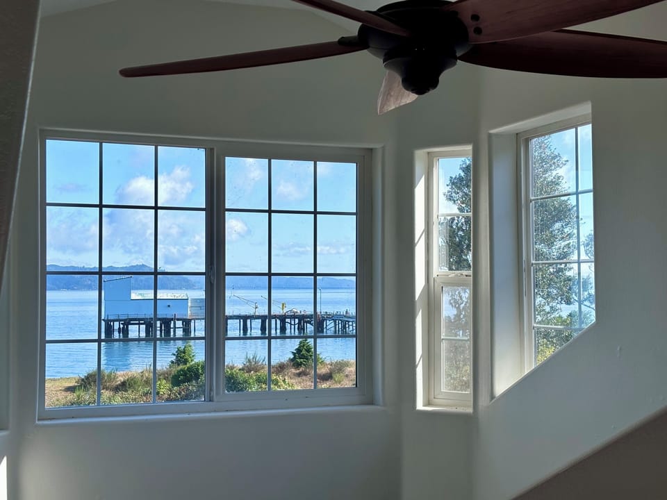 Sweeping river views and natural light from the second level hallway