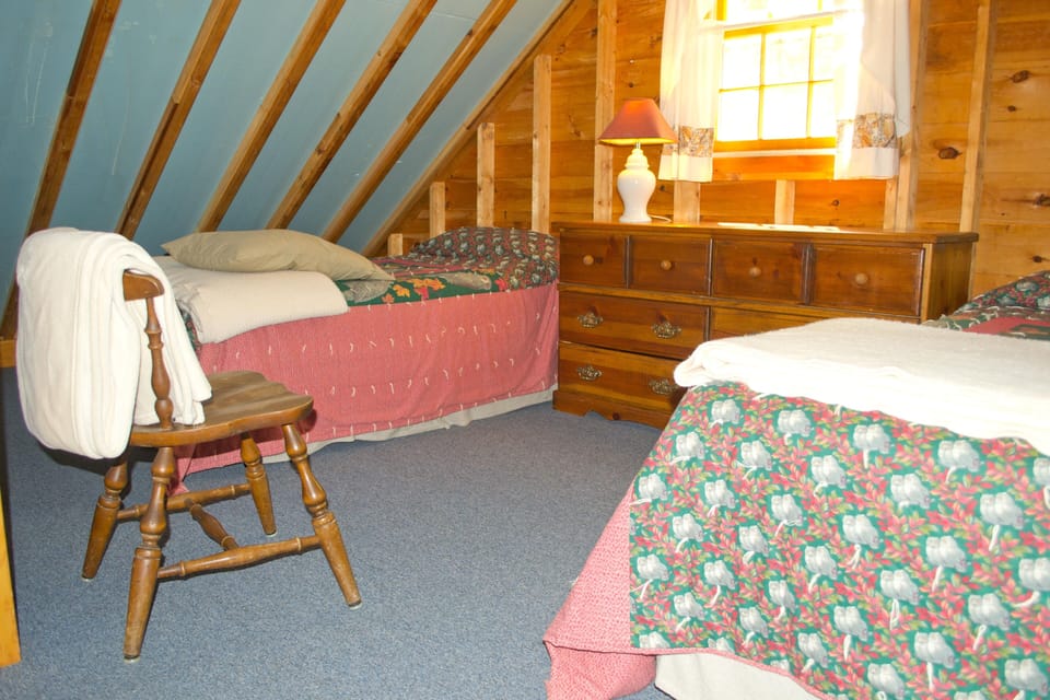 Loft bedroom with three twin beds