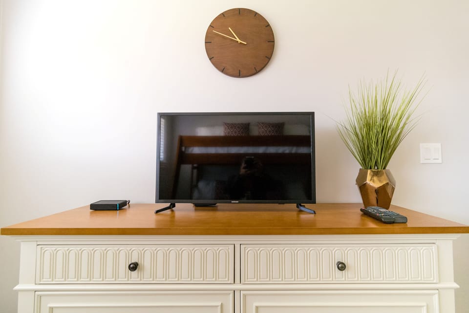 Every room has a large dresser, flat screen TV, cable box & extra bed linens 