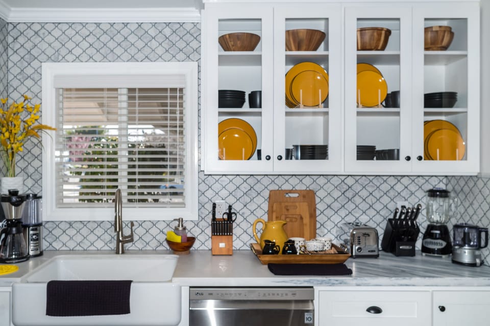 Kitchen is fully stocked for all your cooking & prep needs and a large farm sink