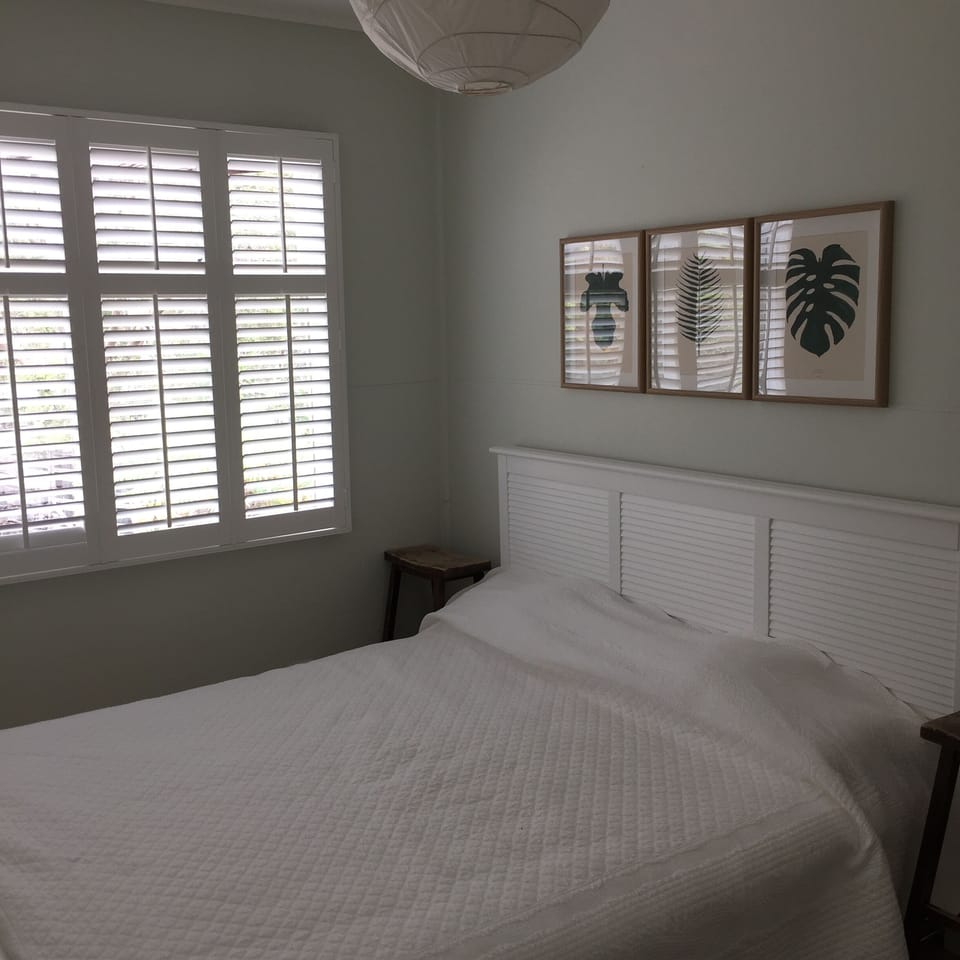 Master bedroom with windows facing front deck