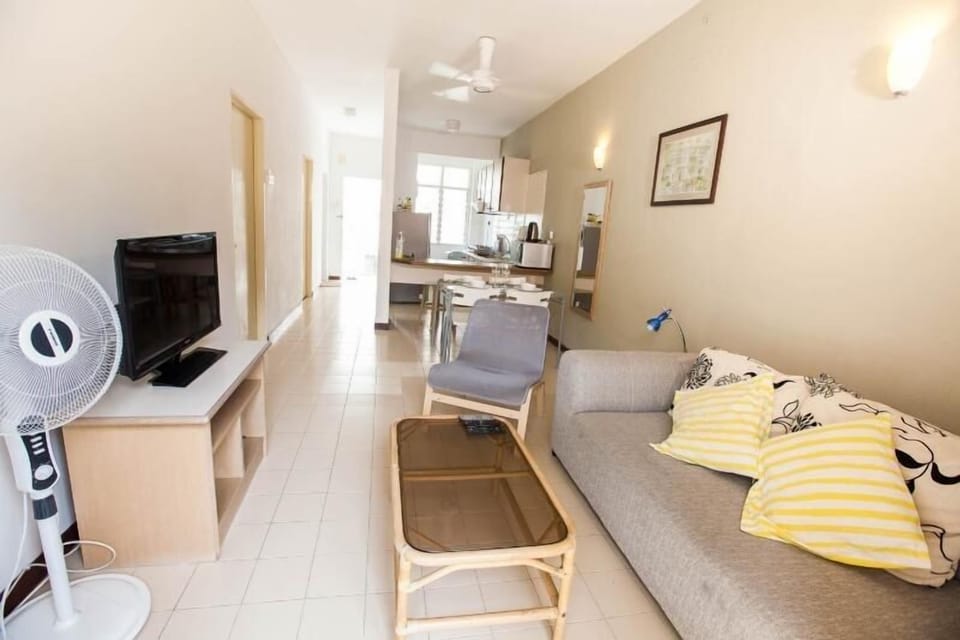 The living room with LED TV, AC and couch