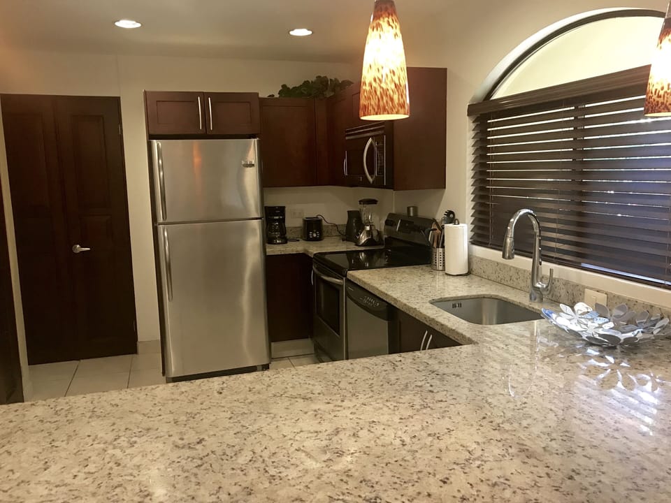 Well appointed kitchen with a dishwasher and washer / dryer.