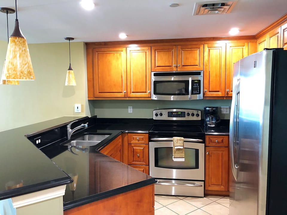 Full-equipped kitchen with granite counter top