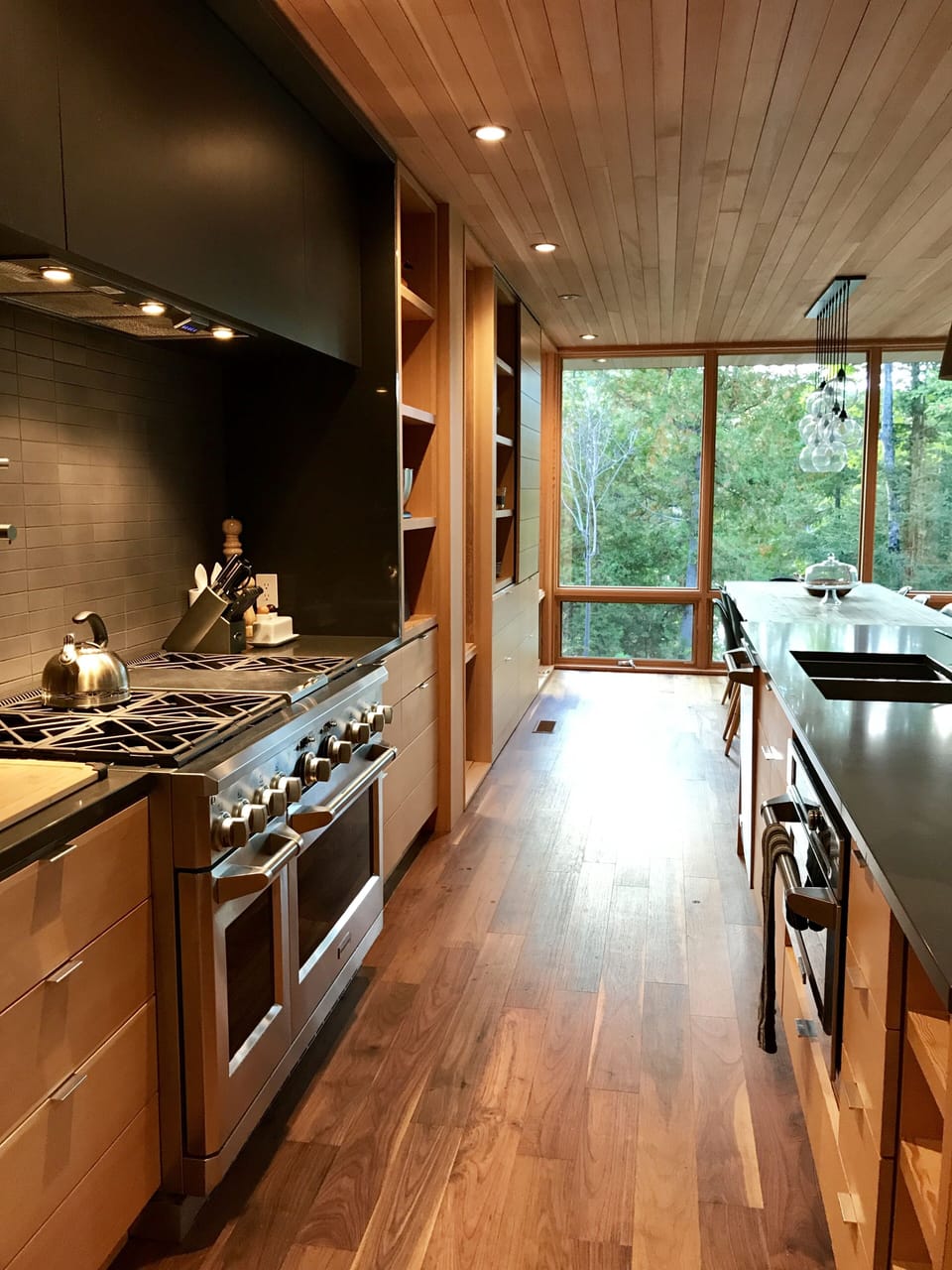 Glass walled dining & gourmet kitchen zone, with built-in GE Monogram appliances