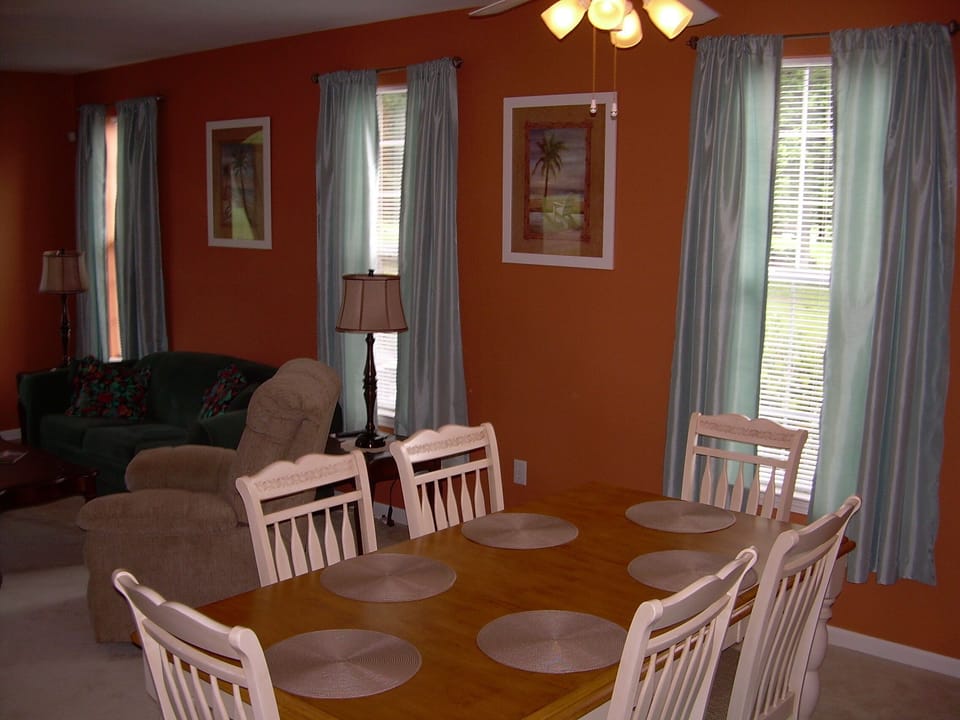 Dinning Room between Kitchen and Living Room Seat Eight (Six Shown)