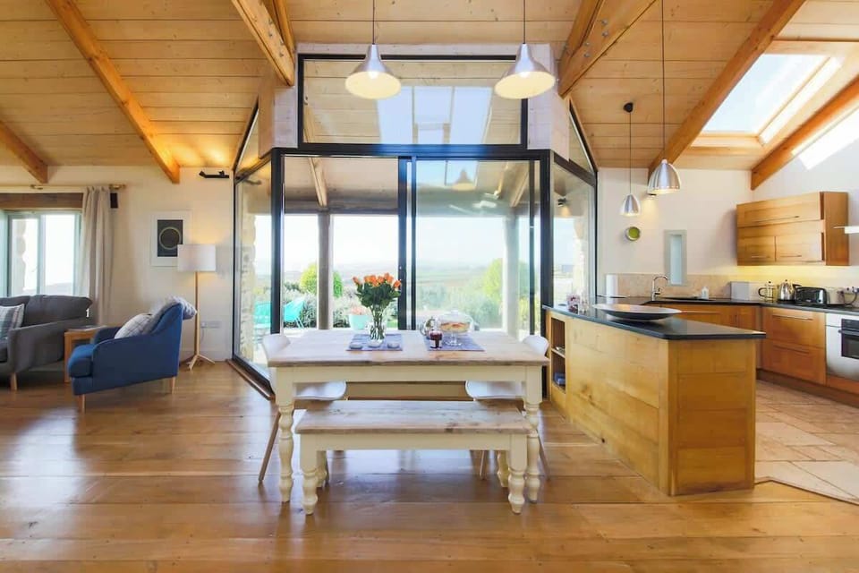 The kitchen, dining area and lounge are in an open layout and flow from one to another.  The views of the countryside and St. Michael's Mount surround you!