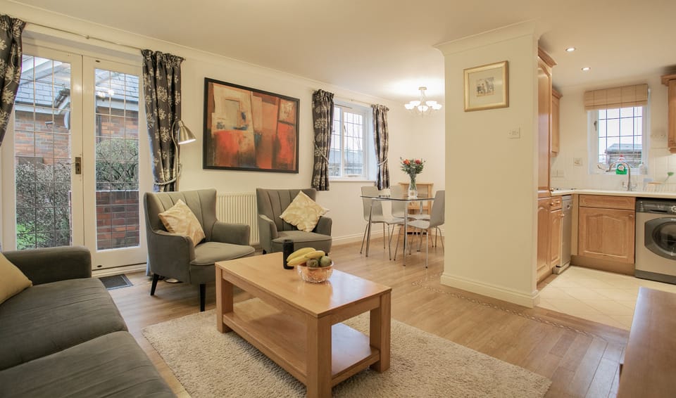 Open plan living area with dining room and kitchen in view.