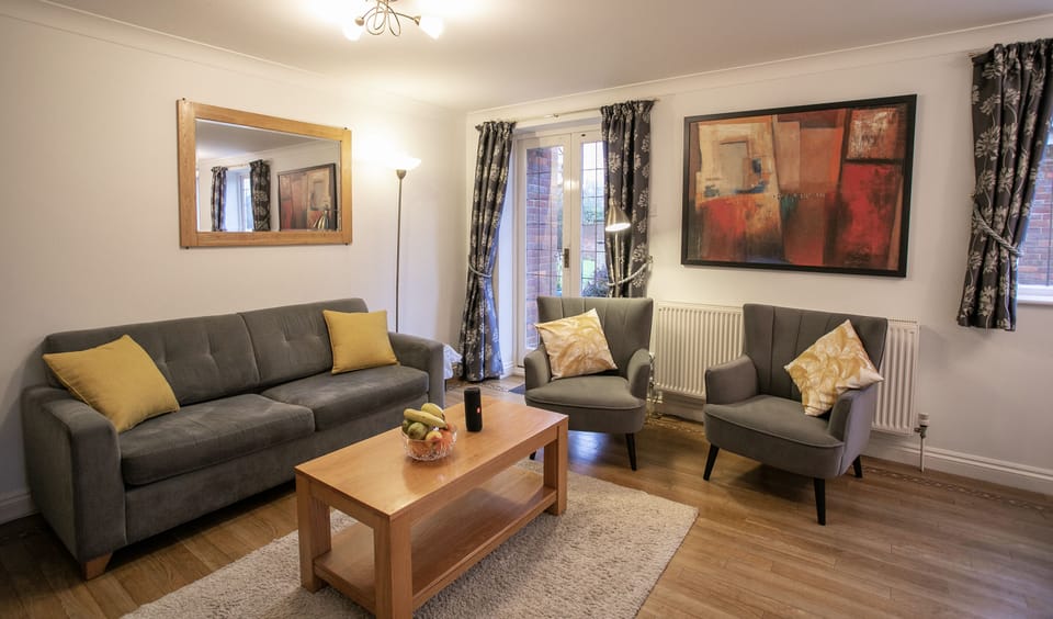 Living room with large flat screen HD TV, Netflix's and blue tooth speaker