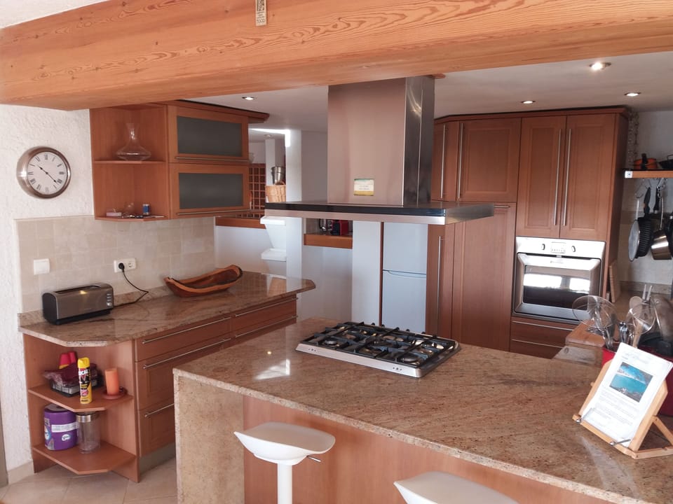 Modern solid wood open plan kitchen.