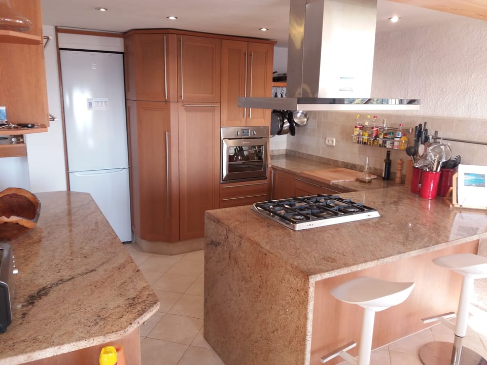Modern solid wood open plan kitchen.