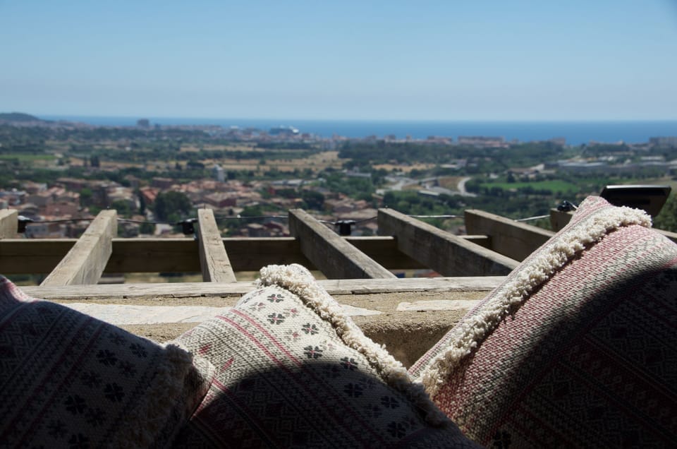 The kitchen terrace sofa and views.