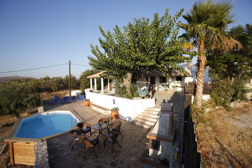 Large BBQ , 8 seater stone dining table and pool side furniture with 4 sunbeds 