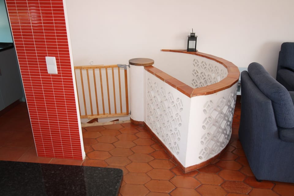 Circular stone staircase leads down to  bedrooms & hallway on the ground floor
