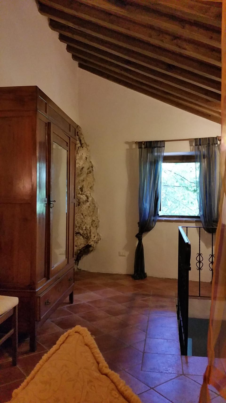 The top bedroom with part of the mountain in one corner