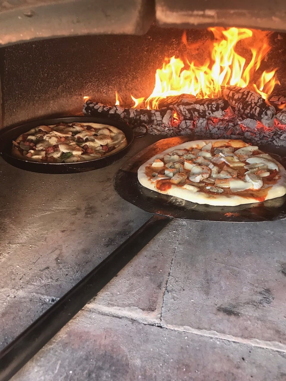 Create your own pizzas in our outside wood oven
