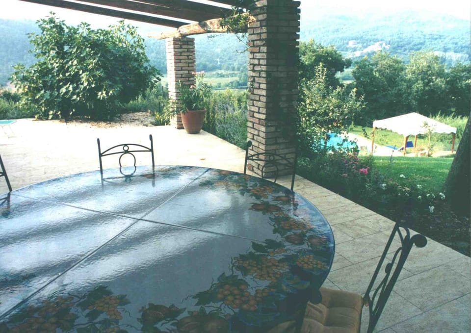 Outside dining table in the shade of the portico